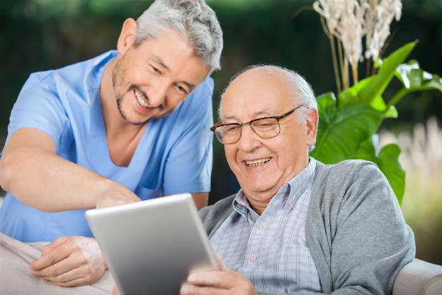 Hospice nurse enjoying patient