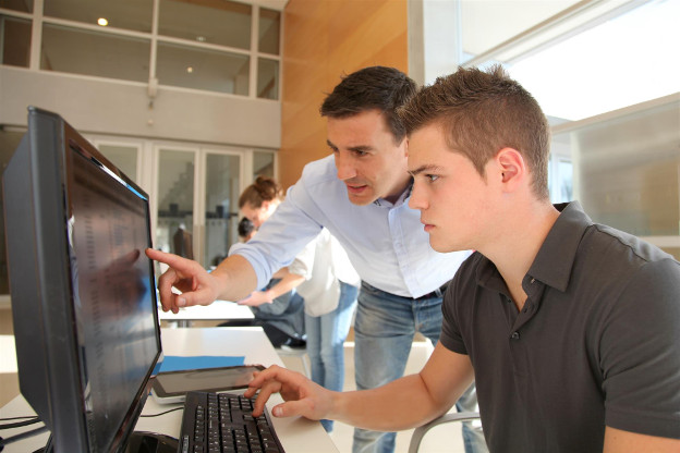 Instructor teaching student using online video